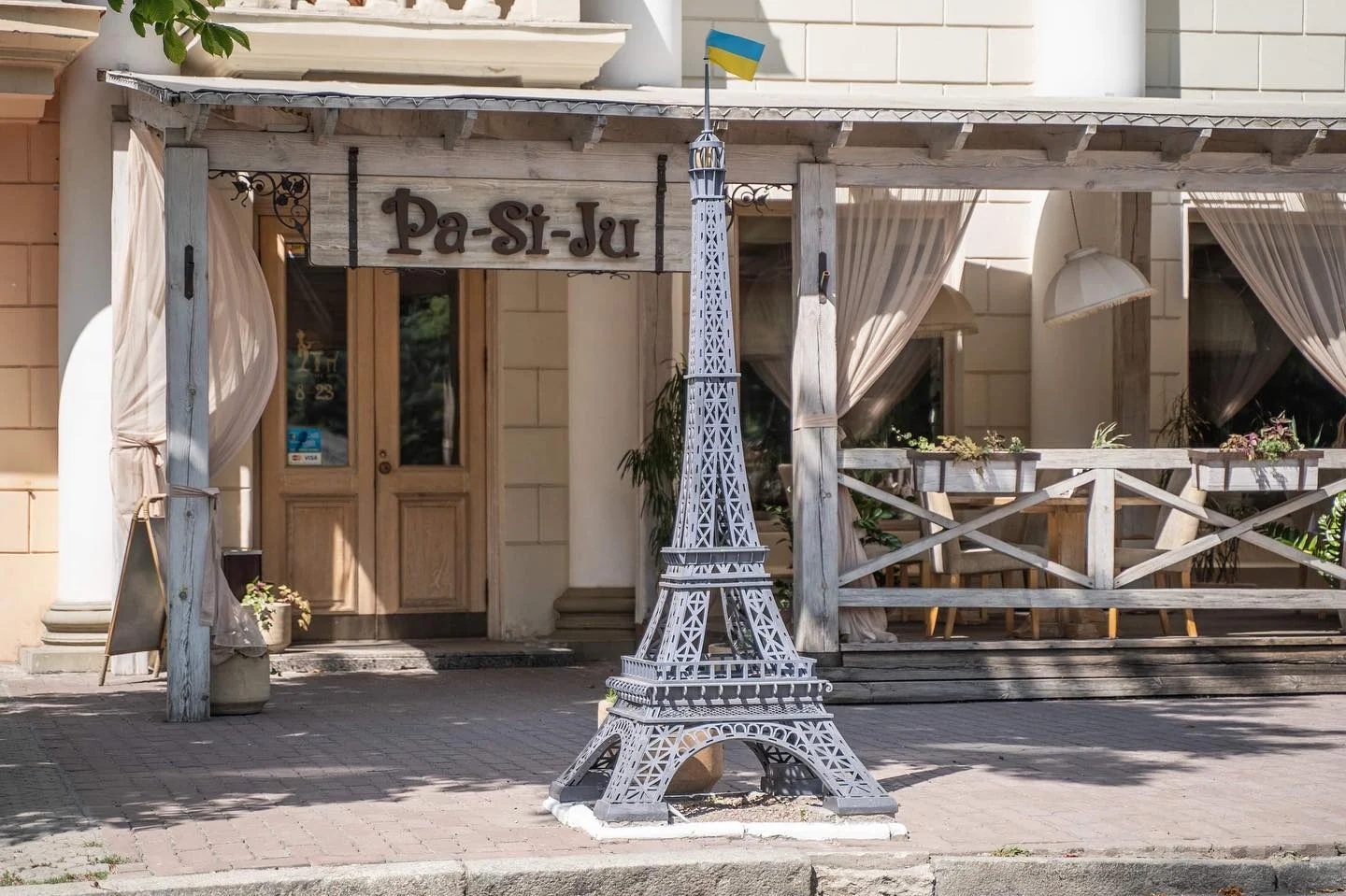 Tower on pavement in front of a restaurant, Dnipro